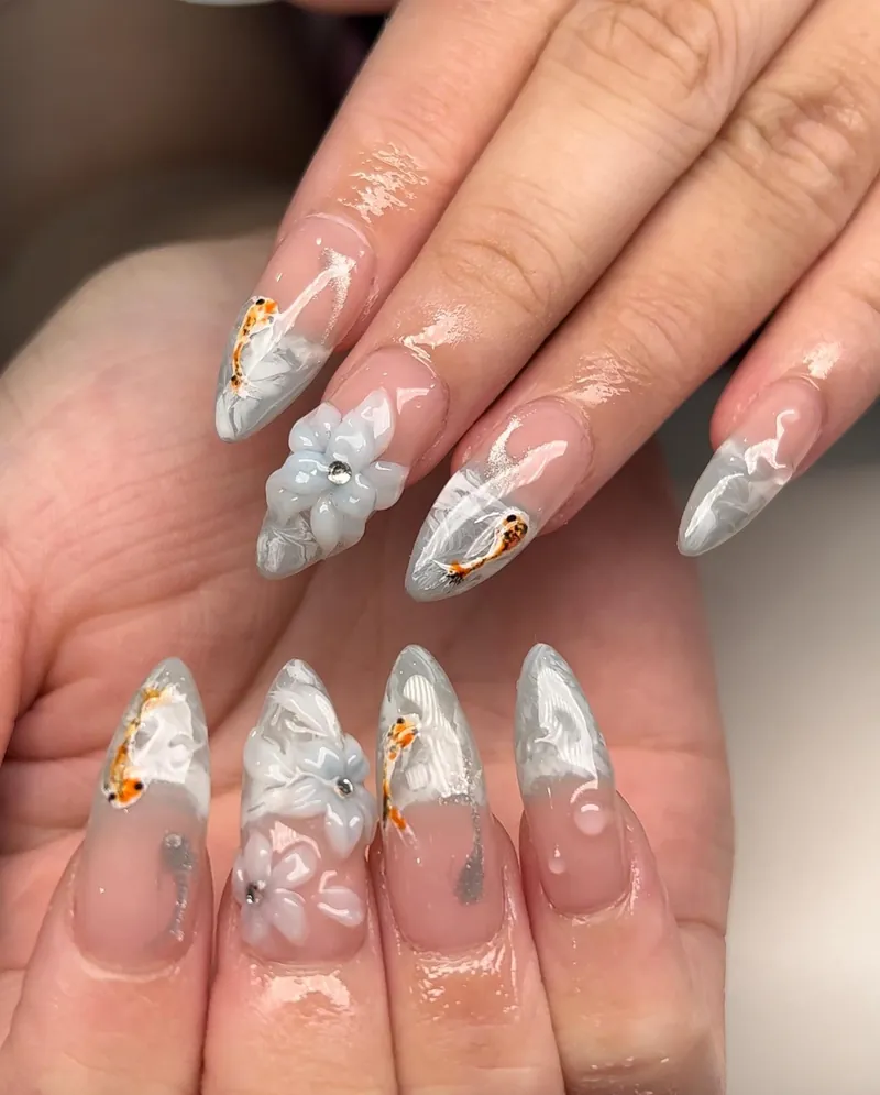 Clear almond nails with 3D koi fish, bubbles and gold leaf