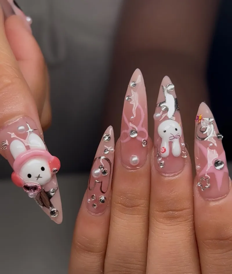 Pink stilettos with a 3D white rabbit in a pink hat, little bunnies and pearls